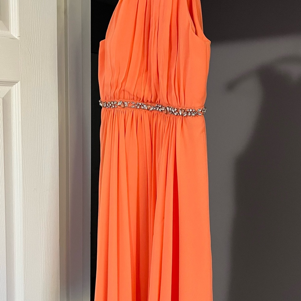 Chic Orange Sleeveless Dress with Embellished Waist